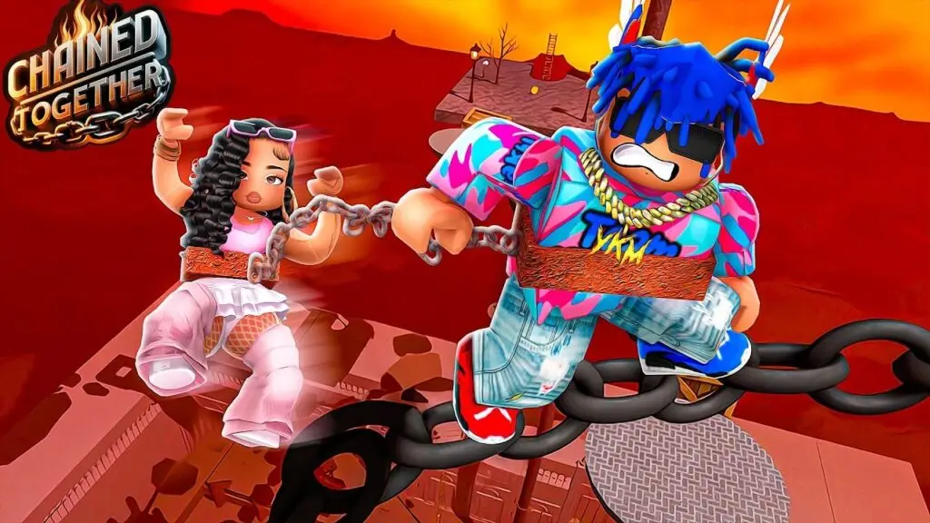 A vibrant, high-energy image of two Roblox avatars connected by a chain in the game Chained Together. A female avatar with long, curly brown hair and a pink outfit is linked to a male avatar with spiky blue hair and a colorful, abstract-patterned jacket. They are mid-air, appearing to jump or fall between large, floating chain links, with a striking red sky and abstract platform in the background. The intense and cooperative theme of the game is clearly depicted, making this an ideal visual for a blog post on Roblox games for couples.
