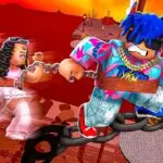 A vibrant, high-energy image of two Roblox avatars connected by a chain in the game Chained Together. A female avatar with long, curly brown hair and a pink outfit is linked to a male avatar with spiky blue hair and a colorful, abstract-patterned jacket. They are mid-air, appearing to jump or fall between large, floating chain links, with a striking red sky and abstract platform in the background. The intense and cooperative theme of the game is clearly depicted, making this an ideal visual for a blog post on Roblox games for couples.